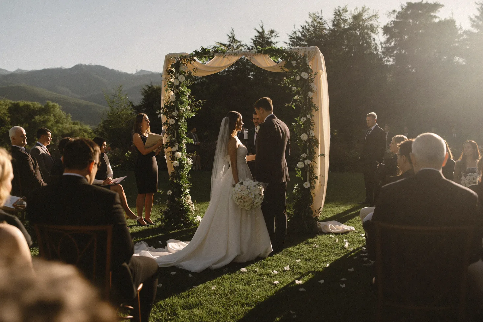 Outdoor wedding ceremony at golden hour
