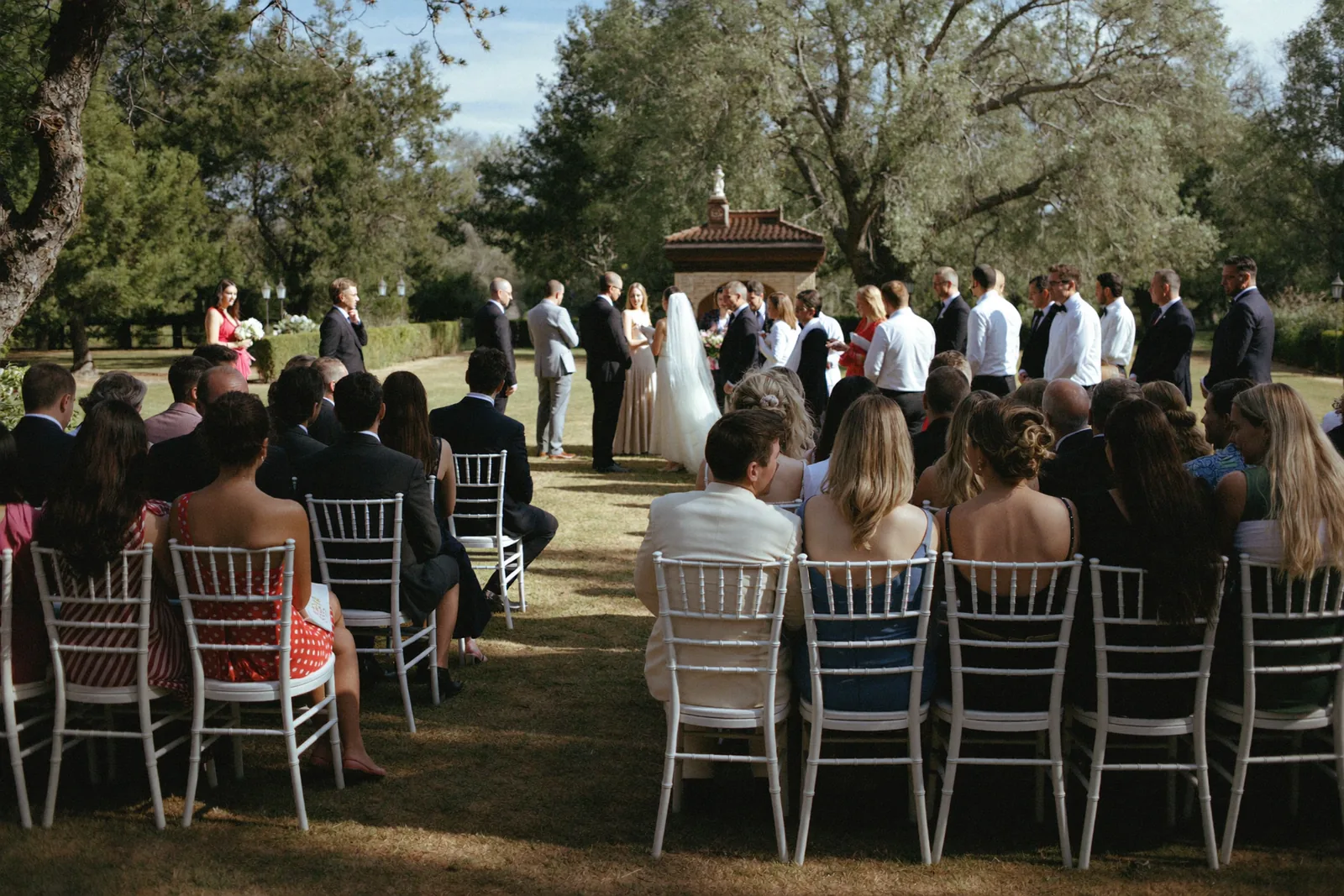Guests gathered for an outdoor wedding ceremony