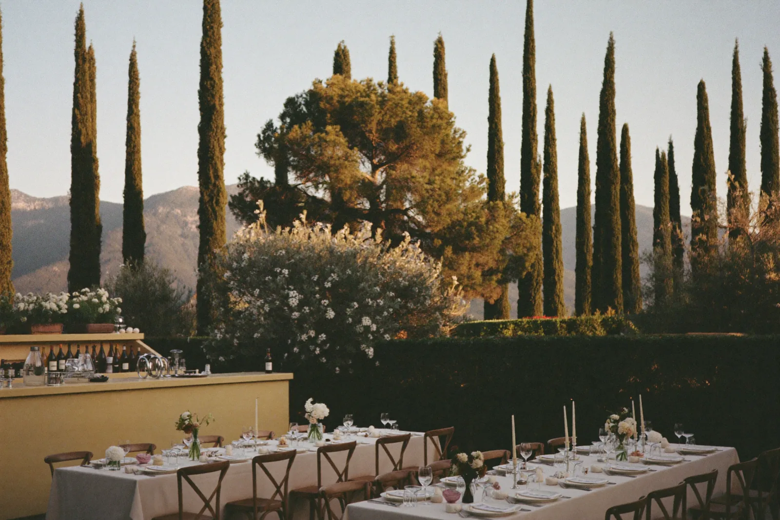 Wedding venue with reception tables and a bar